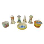 A mixed group of Clarice Cliff, comprising a collection of four pepper pots, including conical '