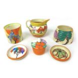 A collection of Clarice Cliff, including a 'Trees and Houses' milk jug, a/f, 9.5cm high, an 'Autumn'