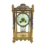 An Edwardian champleve enamel and gilt brass mantel clock, retailed by Pearce & Sons,