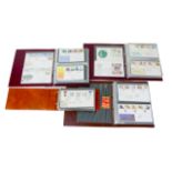 A collection of First Day covers, in four albums, spanning 1973 to 1997. (1 box)