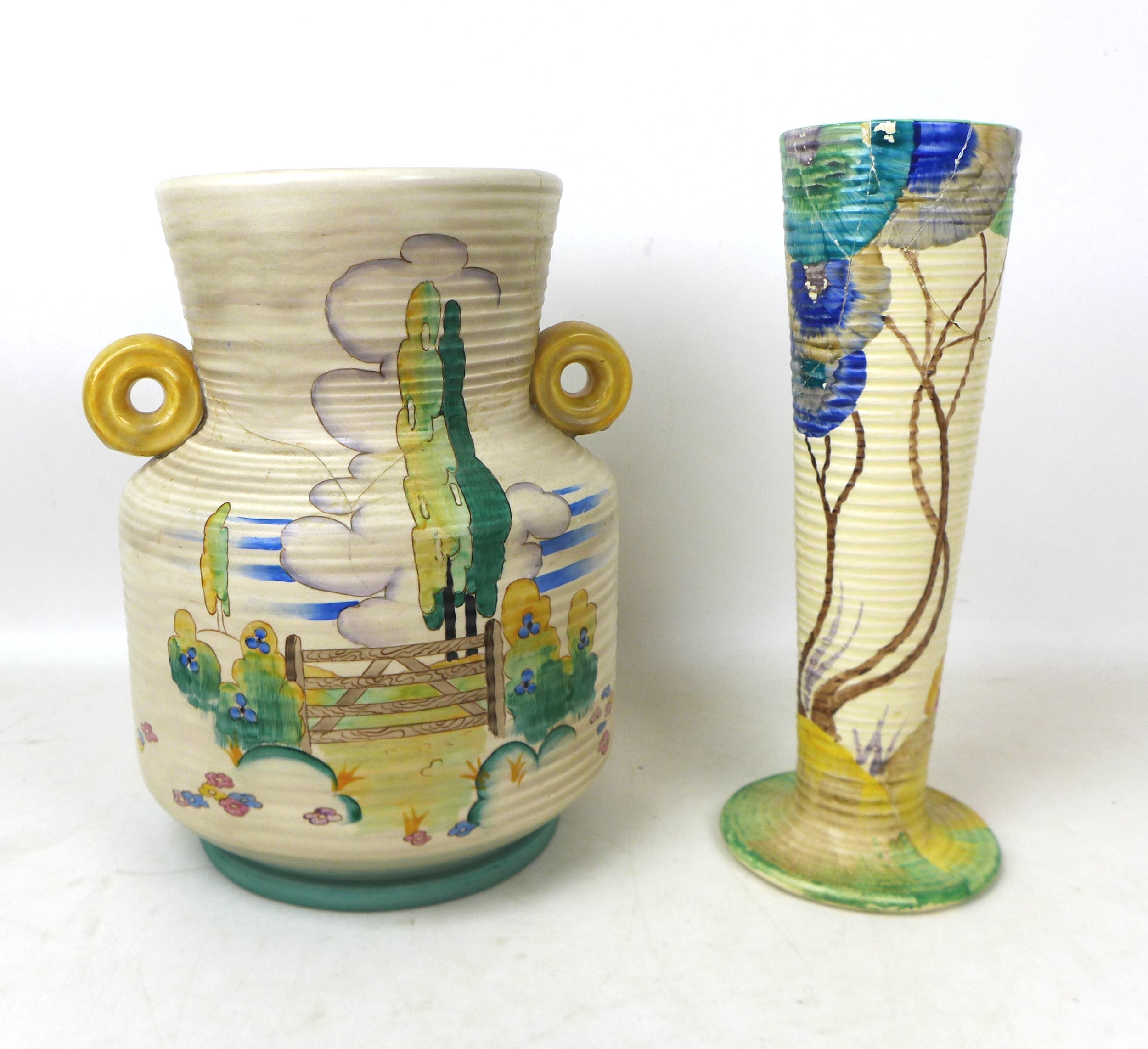 Two large Clarice Cliff vases, comprising a ribbed 'Stile and Trees' patterned vase with swollen