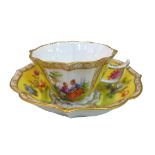 A Dresden porcelain tea cup and saucer, 19th century, of lobed and fluted form, decorated with