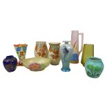 A collection of Art Deco vases, including a by Charlotte Rhead in the Autumn leaves pattern, the