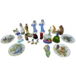 A group of ceramic figurines, including two Royal Doulton Flambe animals, modelled as a cat and fox,