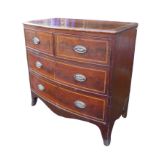 An early 19th century mahogany and inlaid chest of drawers