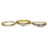 A group of three gold rings, the first 22ct with an illusion set diamond, size Q, 3.8g, the second