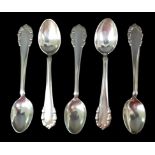 Five Georg Jensen Lily of the Valley pattern silver teaspoons, comprising one circa 1925 teaspoon,