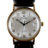 A Delma 9ct gold cased gentleman's wristwatch, with silvered dial, case 33mm, on a black strap.