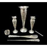 A group of silver, comprising three spill vases with weighted bases, a swizzle stick, a shoe horn