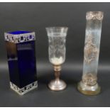 Two silver and white metal mounted glass vases, comprising a blue glass rectangular form vase with