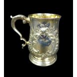 A George III silver tankard, with later repousse decoration, of baluster form with double C scroll