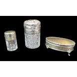 Three Victorian silver topped dressing table bottles, comprising an Edwardian cylindrical form