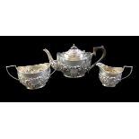 An Edward VII silver three piece bachelors tea set, comprising a teapot, 22.5 by 9 by 12cm high,