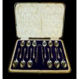 An Edwardian cased set of twelve silver Apostles spoons and sugar tongs, Charles Wilkes Birmingham