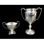 Two George V and later silver twin handled trophies, both without inscriptions, comprising a