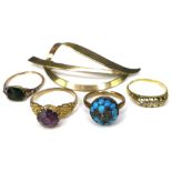A group of four 9ct gold rings, in a variety of designs, sizes O, M, K and G, total gross weight 9.