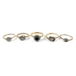A group of five 18ct gold rings, in a variety of designs, sizes M, M, L, J, and K, total gross