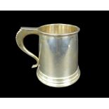 An Elizabeth II silver tankard, of tapering form, the S scroll handle with bead decoration, probably