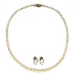 A cultured pearl necklace with 9ct gold clasp, the pearls graduated, 40cm long excluding clasp,