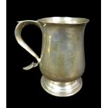 A George III silver tankard, of baluster form, the S scroll handle with heart shaped terminal and