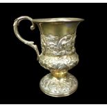 A William IV silver tankard, of urn form with foliate scroll handle, later repousse decoration,