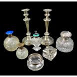 A collection of silver topped ink wells and dressing table bottles, including a Victorian or later
