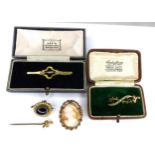 A group of Victorian and later jewellery, comprising a brooch set with oval cabochon tiger's eye,