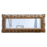 A 19th century rectangular form giltwood framed mirror, the with foliate and pierced decoration, 134