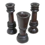 A pair of early 19th century carved oak candlesticks and an associated vase