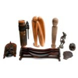 A small group of ethnographic carved wooden items, including a standing figure, 43cm high, head