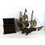 A scratch built wooden model sailing ship, together with a table top cabinet. (2)