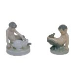 Two Royal Copenhagen figurines of fawns, comprising a fawn with a rabbit (439) and a fawn with a