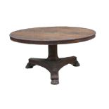 A Regency rosewood breakfast table, circular tilt top with reeded edge, raised on shaped base with