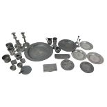 A collection of pewter, including oval serving dishes, largest 41.5cm diameter, a tankard, and