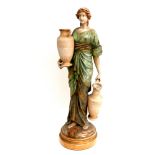 A large Austrian Amphora Pottery figure, modelled as a female water carrier, circa 1880's, decorated