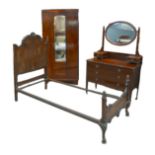 Three pieces of Edwardian bedroom furniture, comprising a dressing table with hinged oval mirror,
