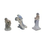 Three Royal Copenhagen figurines of fawns, a fawn and Parrot (752), a fawn and owl (2107),