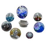 A collection of six paperweights