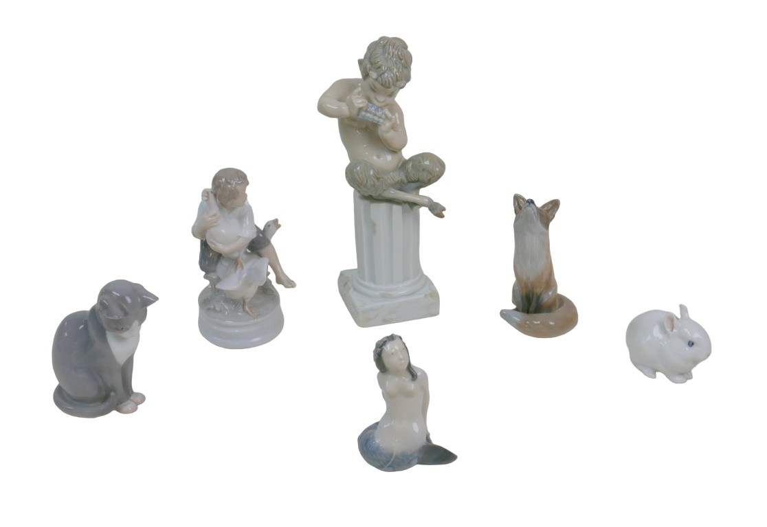 Four Royal Copenhagen figurines, comprising a mermaid (3321), 11cm high, a fox (1475), 14cm high,