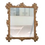 A 19th century style mirror with oak leaf gilt decorated frame, 63 by 76cm high.