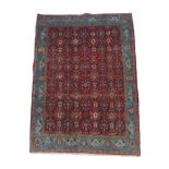 A Hamadan rug, red ground with repeating pattern to central panel, two narrow cream, floral