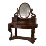 A Victorian mahogany dressing table, its hinged oval mirror with shaped supports, two banks of six
