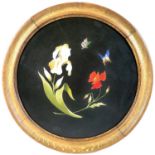 A 19th century Italian pietra dura plaque, of circular form depicting a white iris and a red poppy