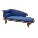 A Victorian chaise longue, with mahogany frame and blue upholstery, raised upon brass castors, a/