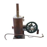 A miniature single-piston stationary engine and boiler, with piston housing marked 'KB' and boiler