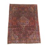 A Bijar rug, on red ground, blue central medallion with pendant anchors, on densely decorated field,