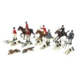 A Britains fox hunting set, comprising three mounted huntsmen, nine hounds, a fox, a hare, and