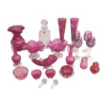 A collection of cranberry glass items, including bonbon dishes, bowls, and glasses, a/f, together