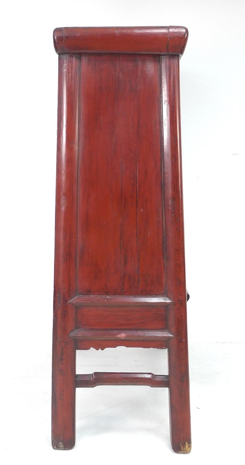 A modern Chinese style cabinet, of tapering form with red lacquered finish, brass butterfly shaped - Image 3 of 4