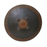 A Moorish style leather shield, with four metal studs to its front, hand painted decoration, two